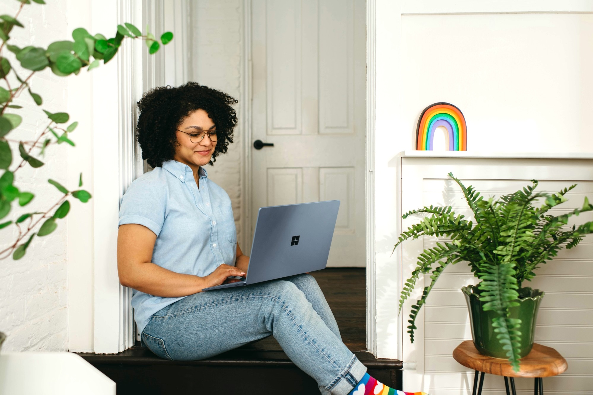 Small business owner using Rounded Pro Plan at home to manage finances and track expenses.